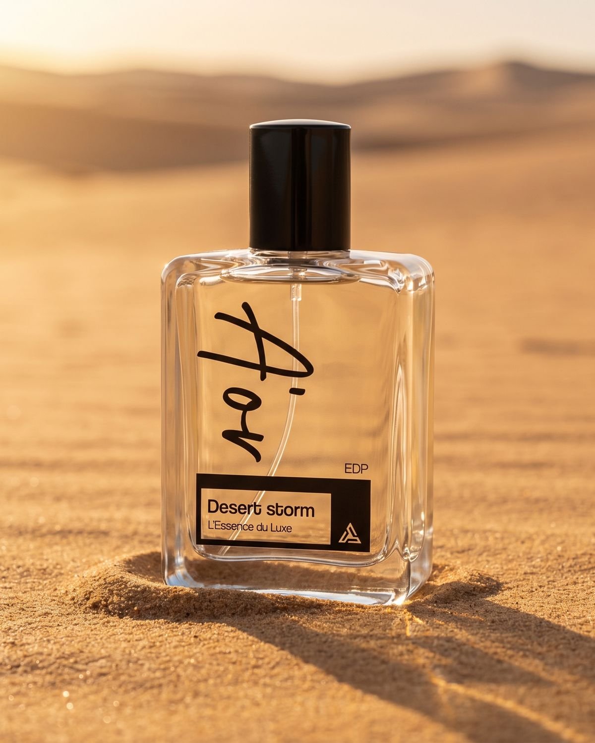 An A'OR Desert Storm bottle standing in sunlit desert sand